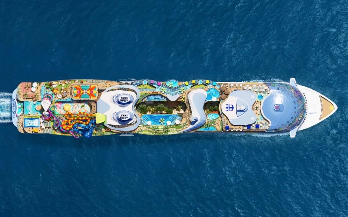 Top-down rendering of Hero of the Seas at sea, showing the Category 6 waterslides at the stern, the pool decks and the glass dome at the bow